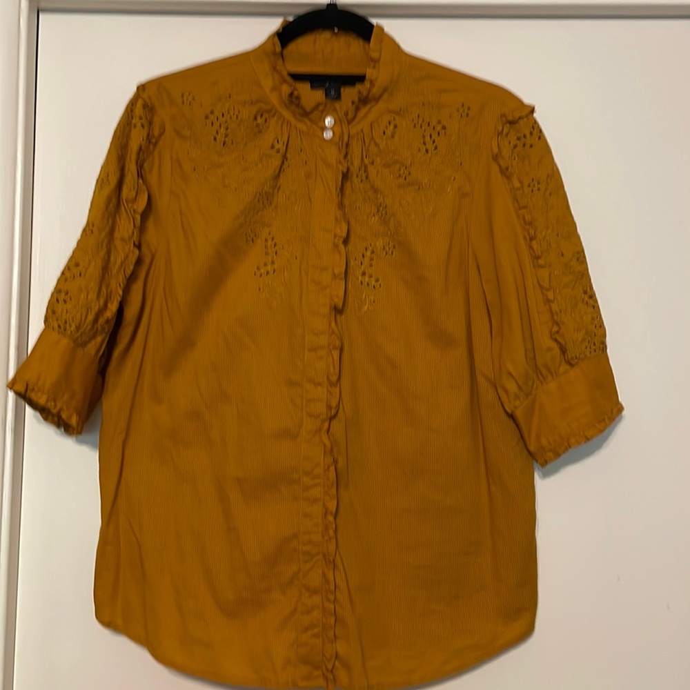 Jcrew size Medium short sleeve pumpkin color eyelet blouse with ruffles.